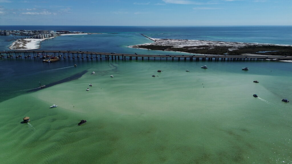 Crab Island Destin Florida aerial view with boats and turquoise water