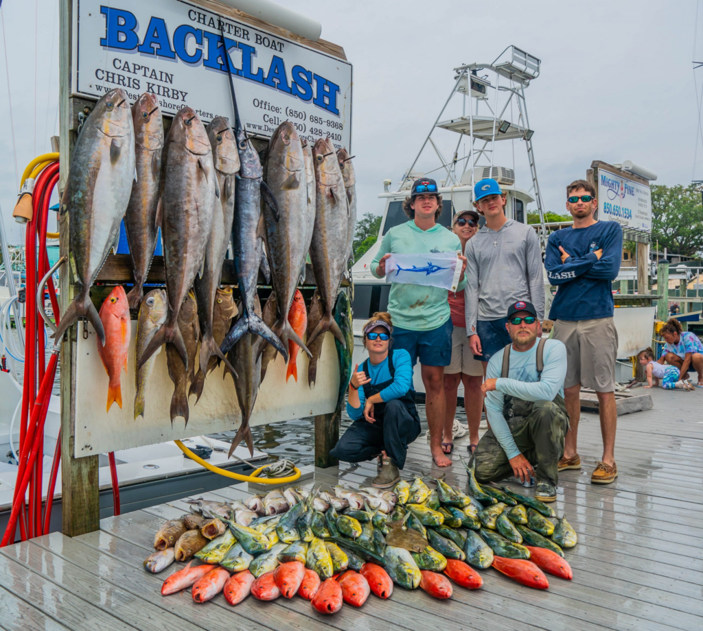Destin fishing charter catch with snapper grouper and mahi mahi on the dock