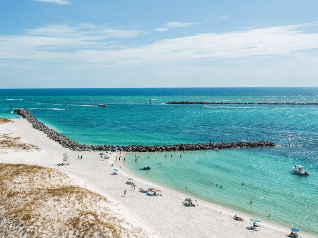 Destin beach near East Pass with emerald water and boats along Florida’s Emerald Coast