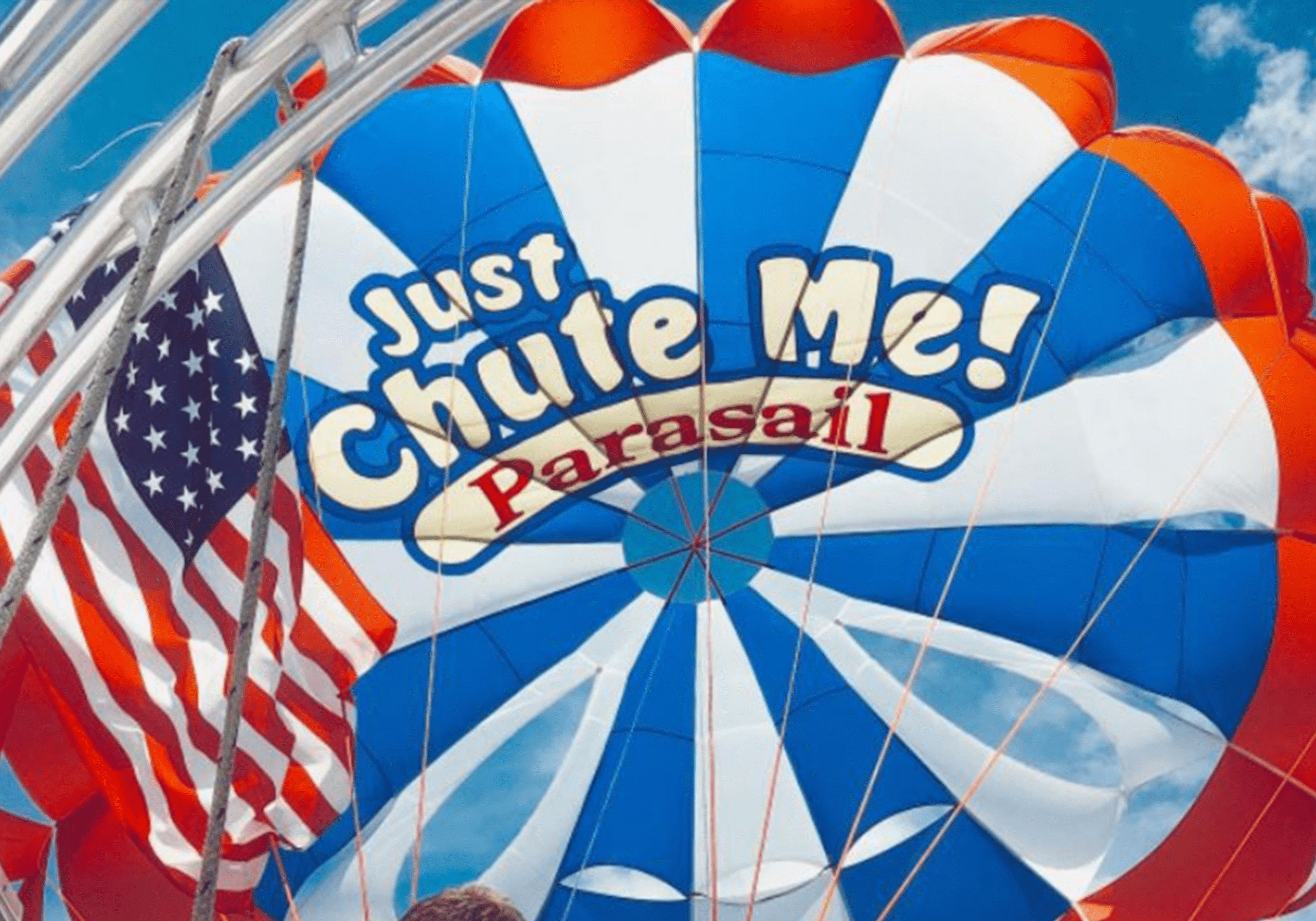Parasailing over Crab Island with colorful parachute in Destin Florida