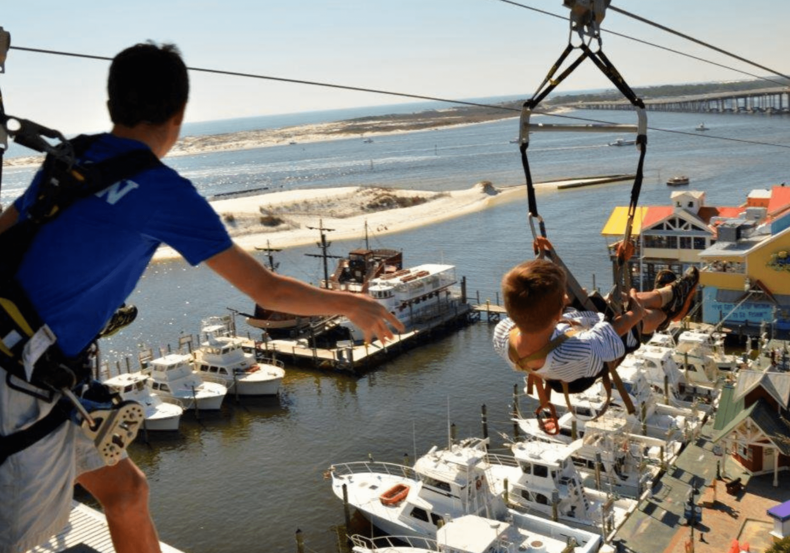 Visitors enjoying Destin Harbor Boardwalk views and activities in Destin Florida