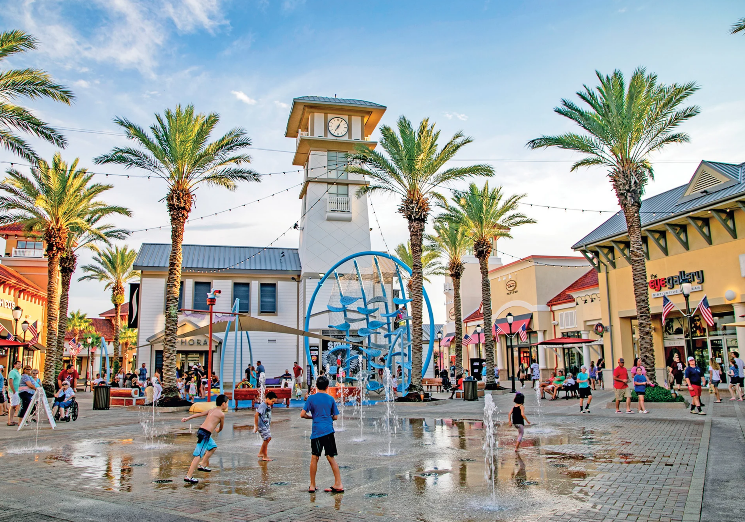 Destin Commons outdoor shopping center with palm trees in Destin Florida