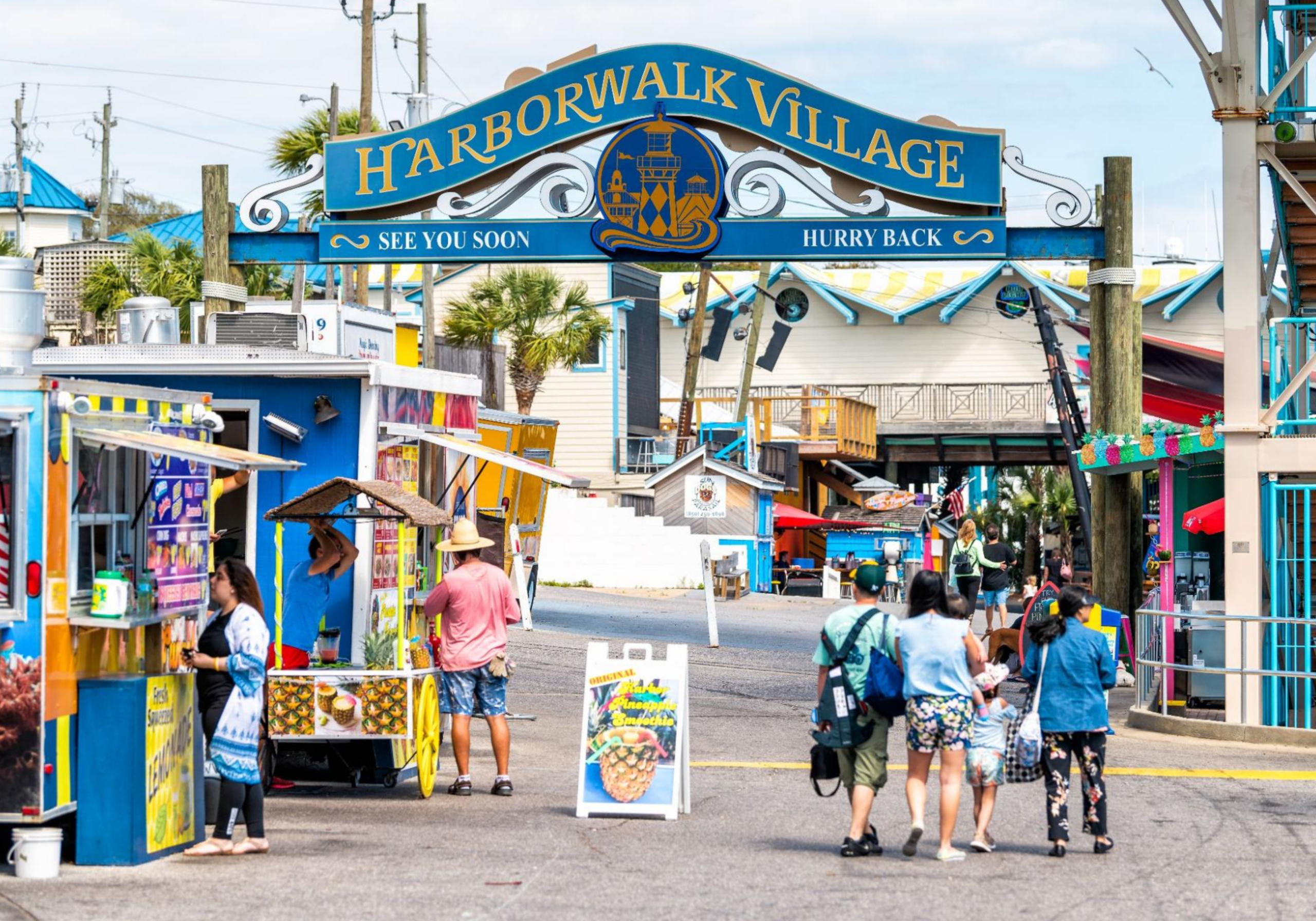HarborWalk Village entrance in Destin Florida with shops and waterfront