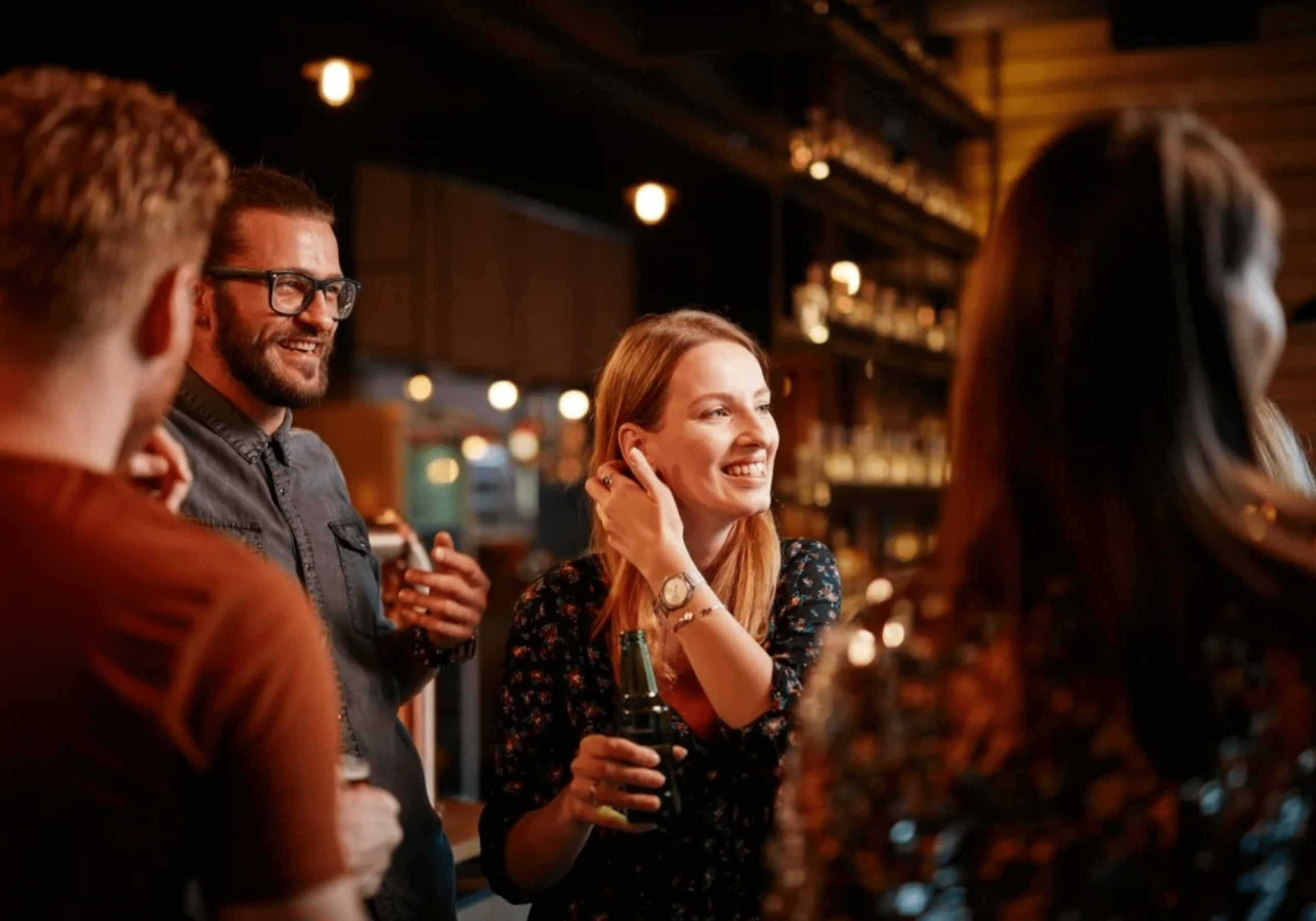 people enjoying drinks and socializing at a bar in Destin Florida