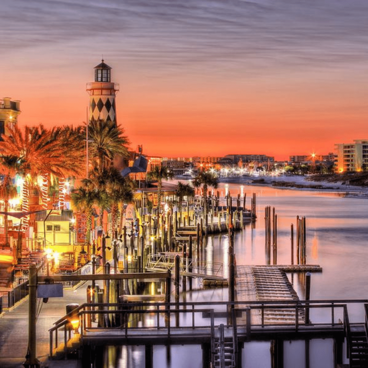 destin harbor at sunset with boats and waterfront lights near sundrift inn florida
