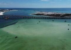 Aerial view of Okaloosa Island beach and fishing pier near Destin Florida on the Emerald Coast