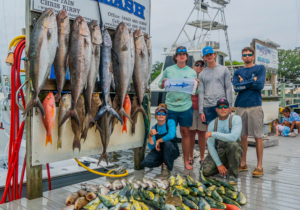 Destin fishing charter catch with snapper grouper and mahi mahi on the dock