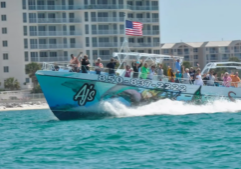 Dolphin cruise boat carrying visitors along the Destin and Okaloosa Island coastline on Florida’s Emerald Coast