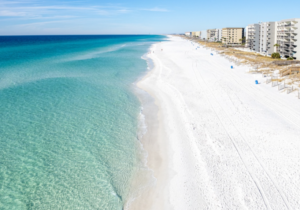 Aerial view of Okaloosa Island beach with white sand and emerald water in Fort Walton Beach Florida on the Emerald Coast